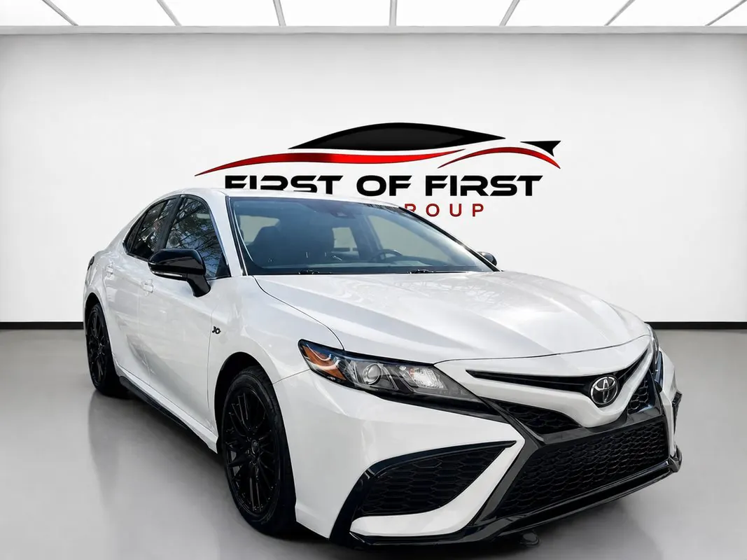 White Toyota Camry in the First of First showroom